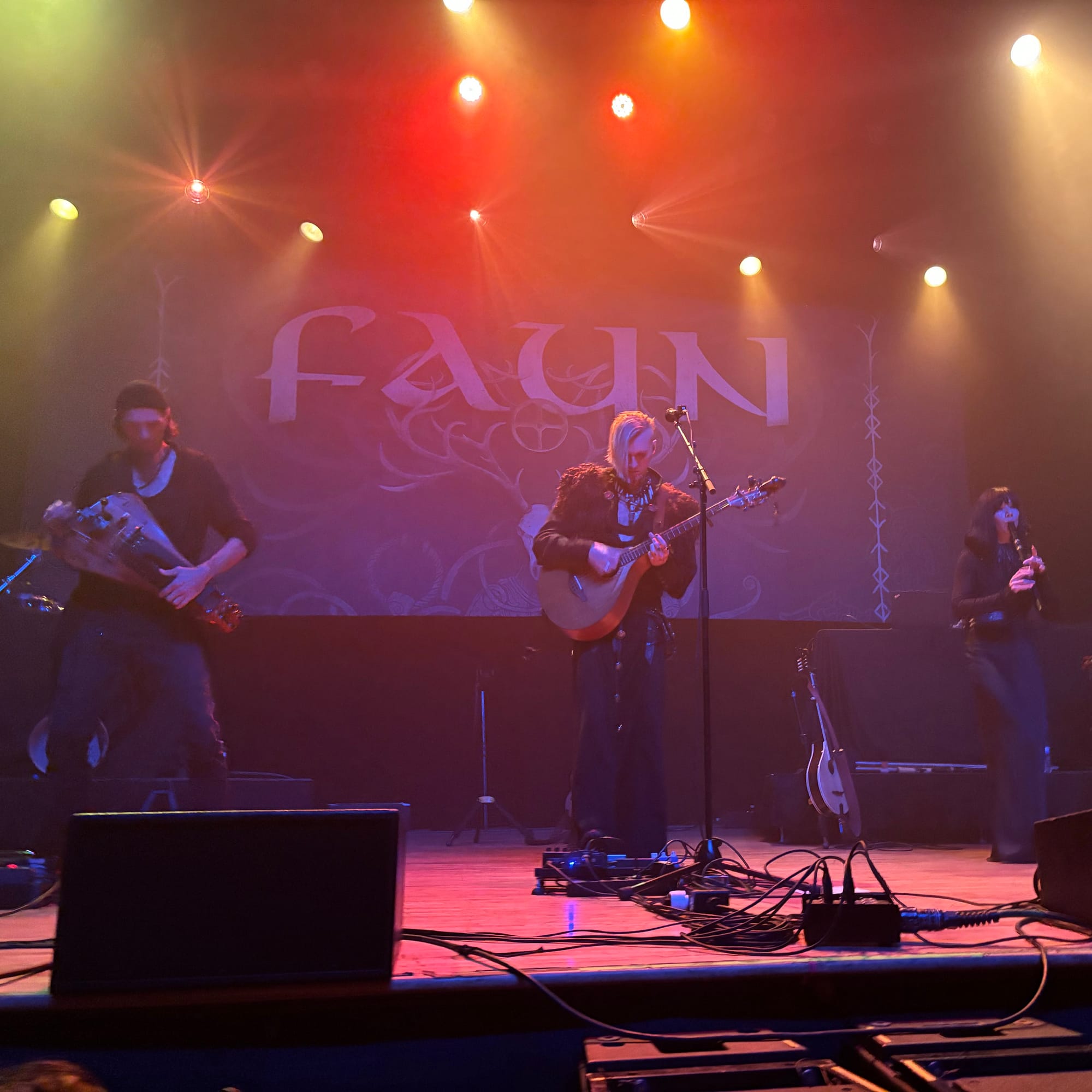 From left to right: Faun members Stephan Groth, Oliver s. Tyr, and Adaya on stage